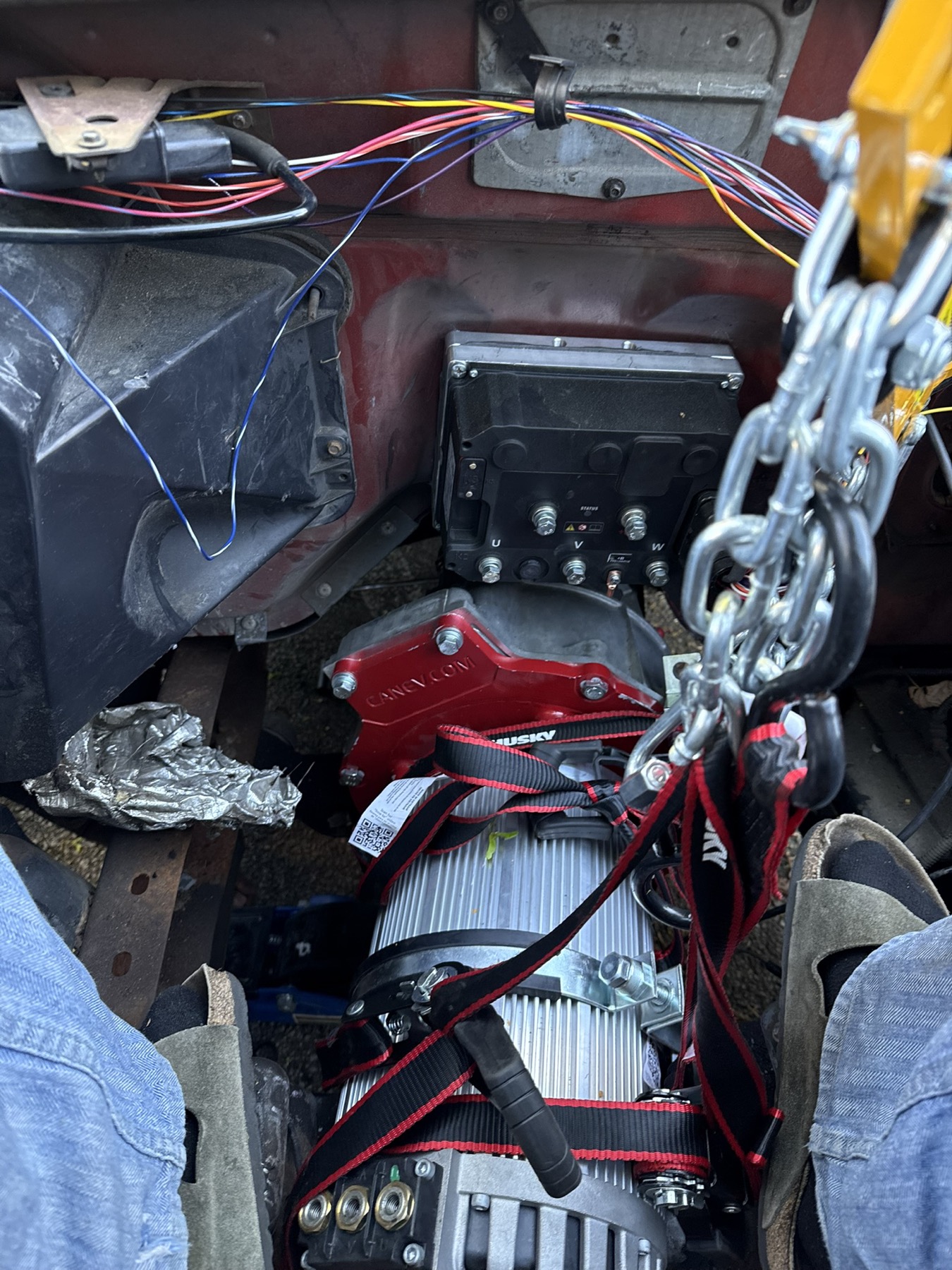 Electric motor and inverter being lowered into the engine bay